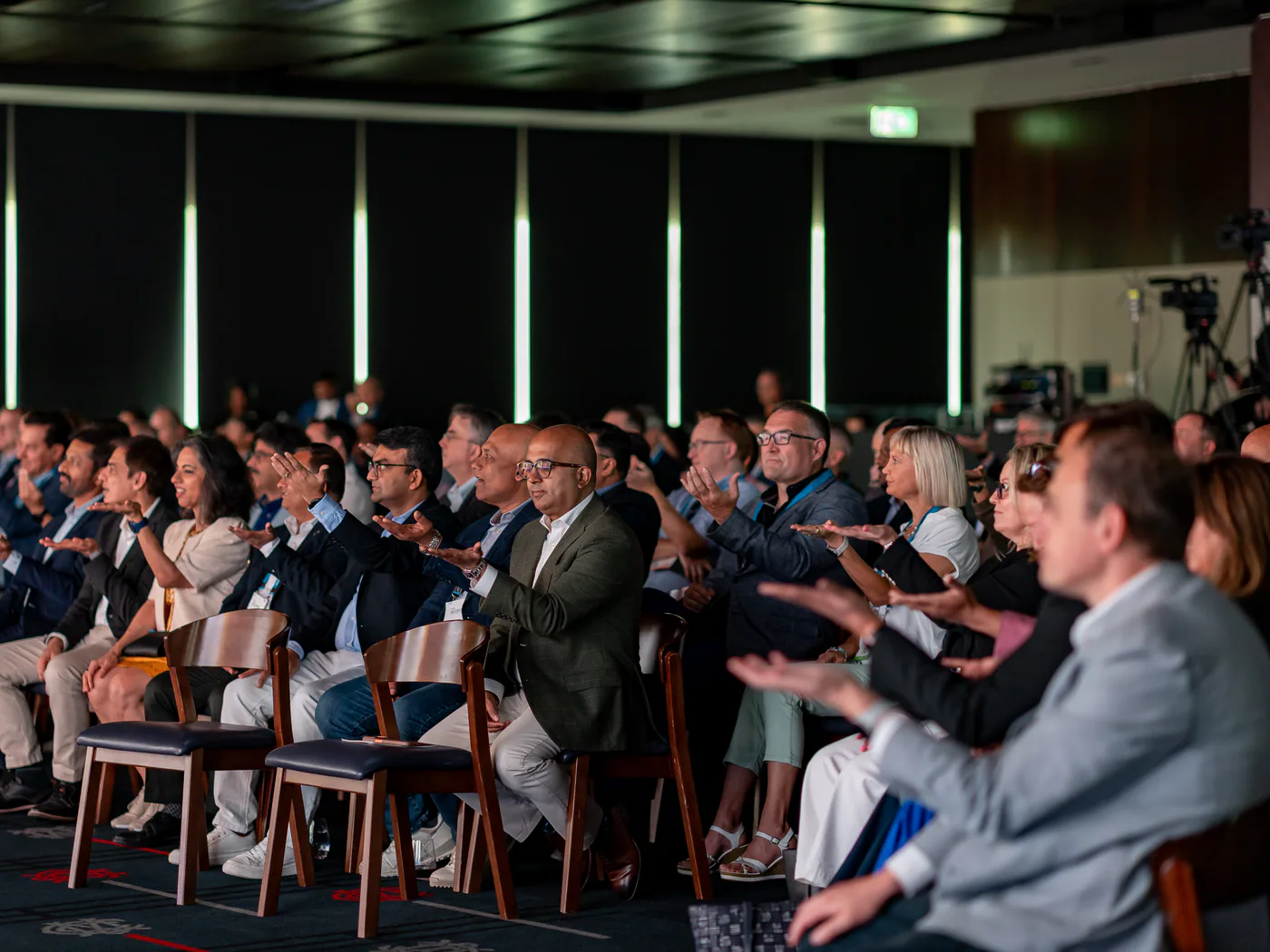 Corporate conference guests reacting during Andy Nunn's keynote