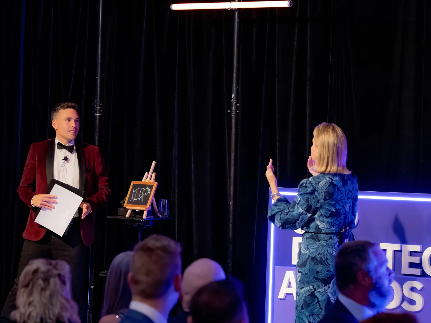 Andy Nunn involving a guest in a live demonstration at a corporate awards event