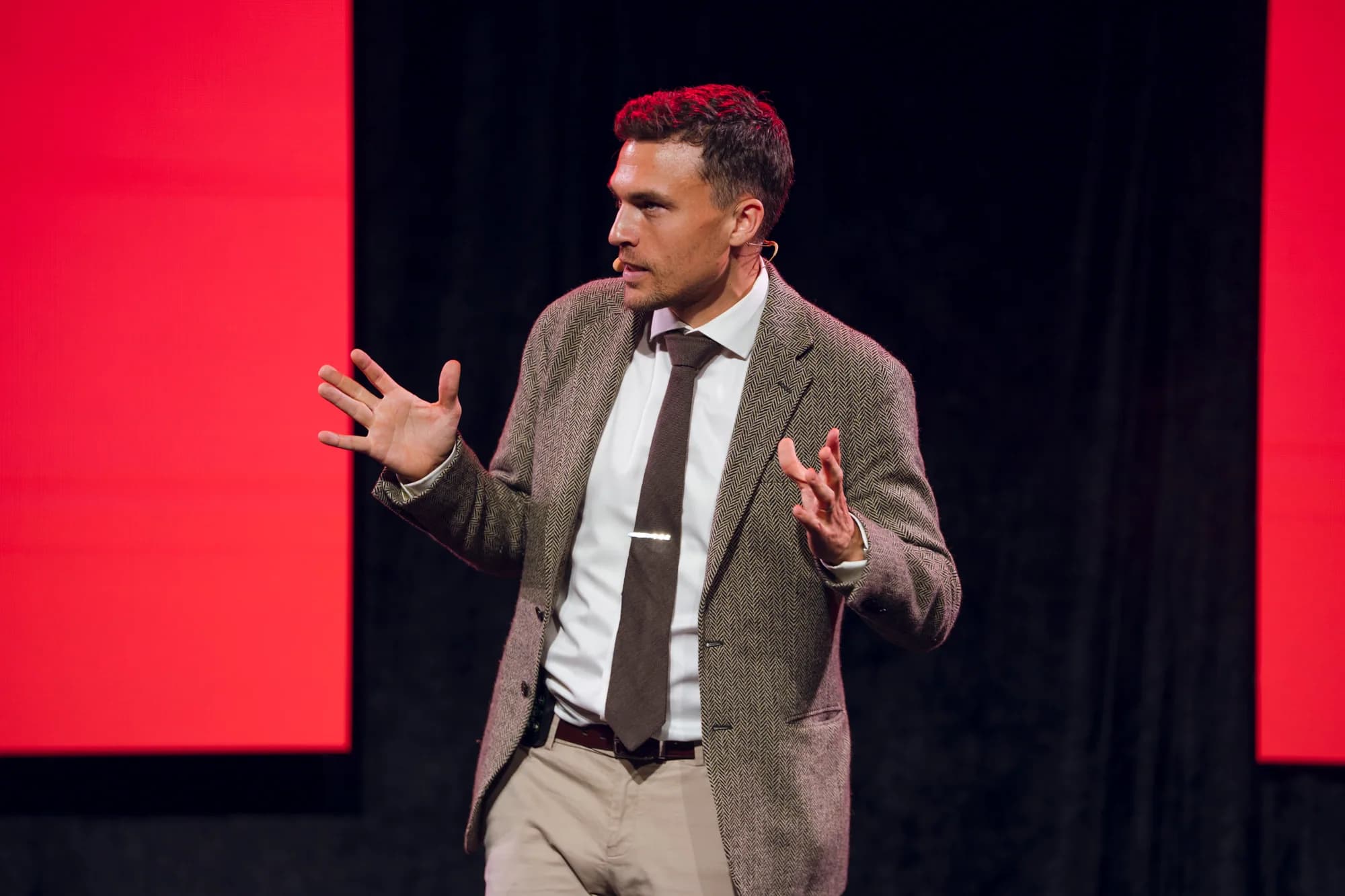Andy Nunn using an expressive gesture during a keynote