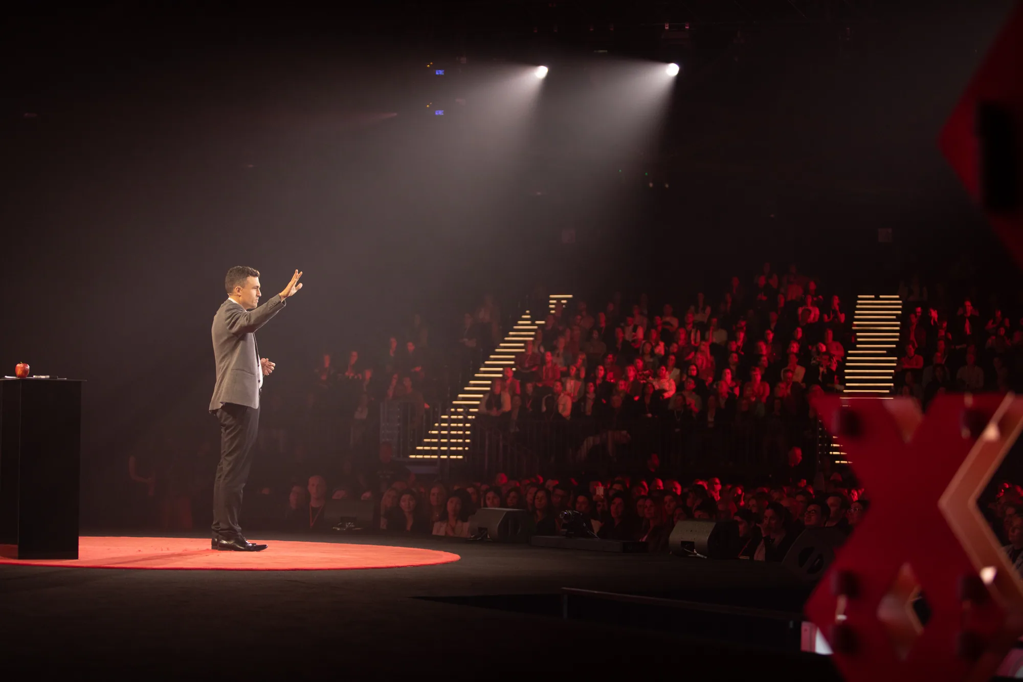 Andy Nunn speaking to a theatre audience from the TEDx stage