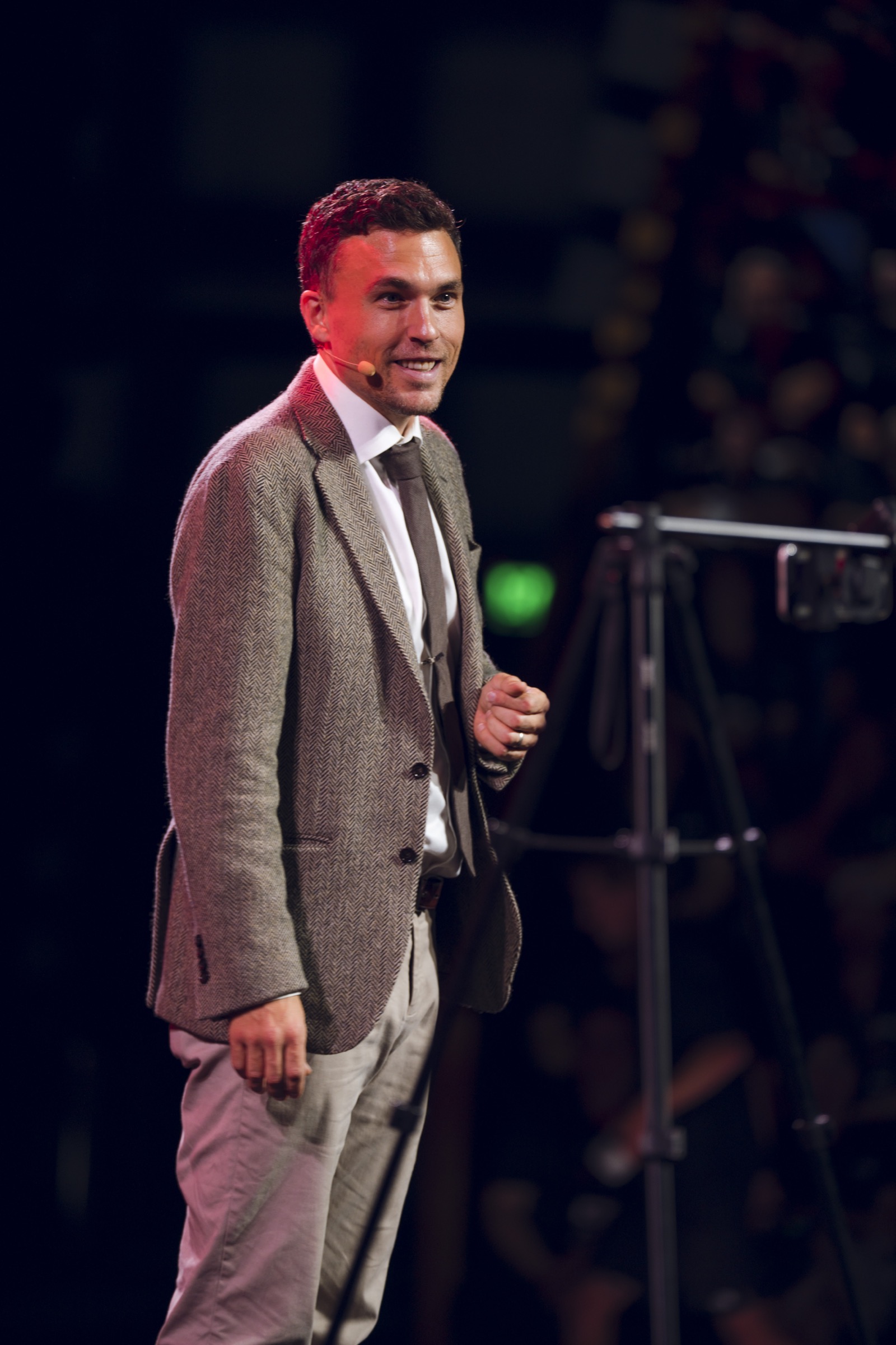 Andy Nunn smiling during a close-up stage performance