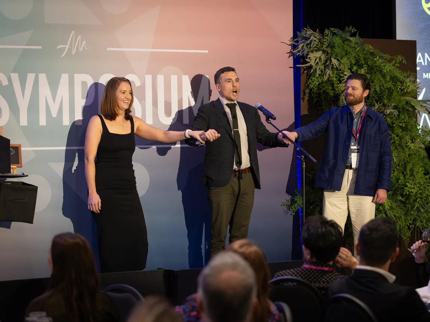 Andy Nunn sharing an interactive moment with participants on stage