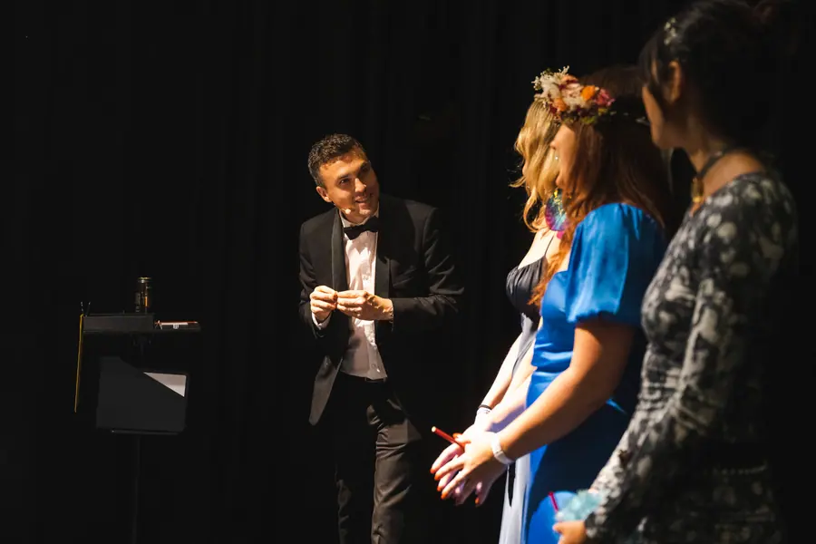 Andy Nunn engaging gala guests in an audience participation routine for corporate entertainment