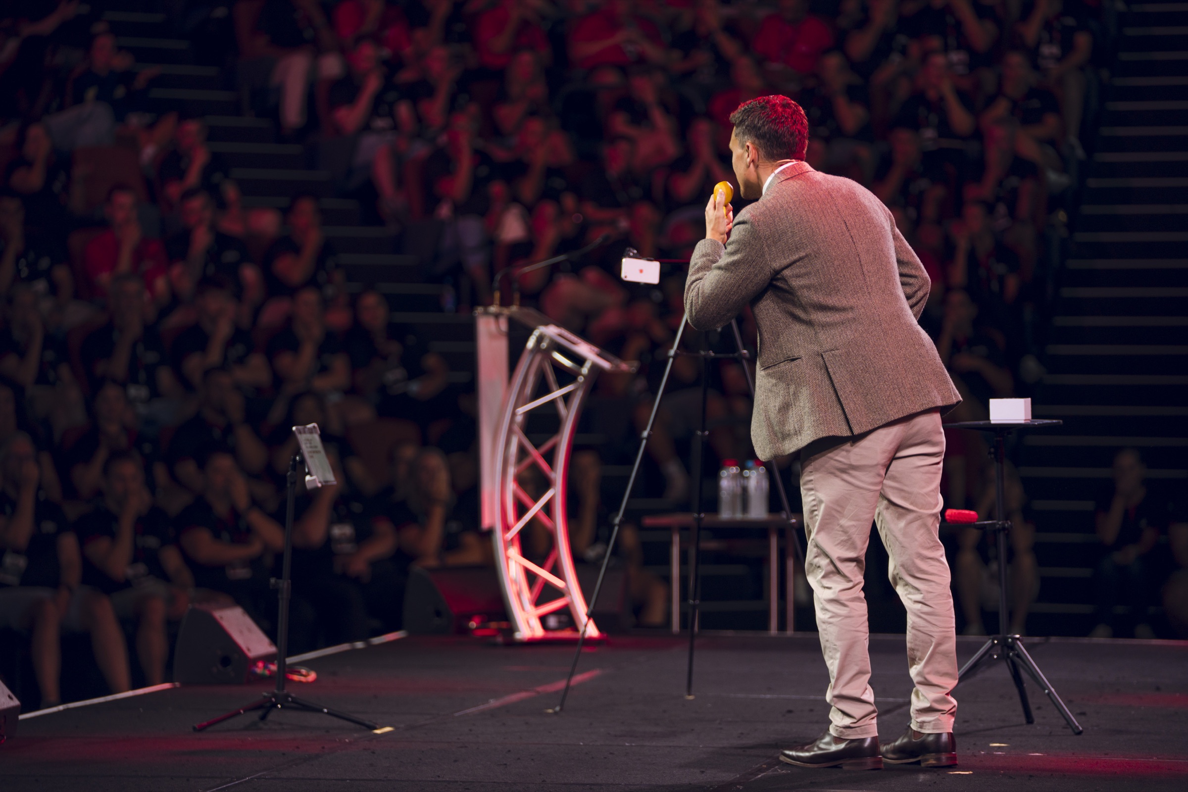 Andy Nunn speaking to a large conference audience in New Zealand