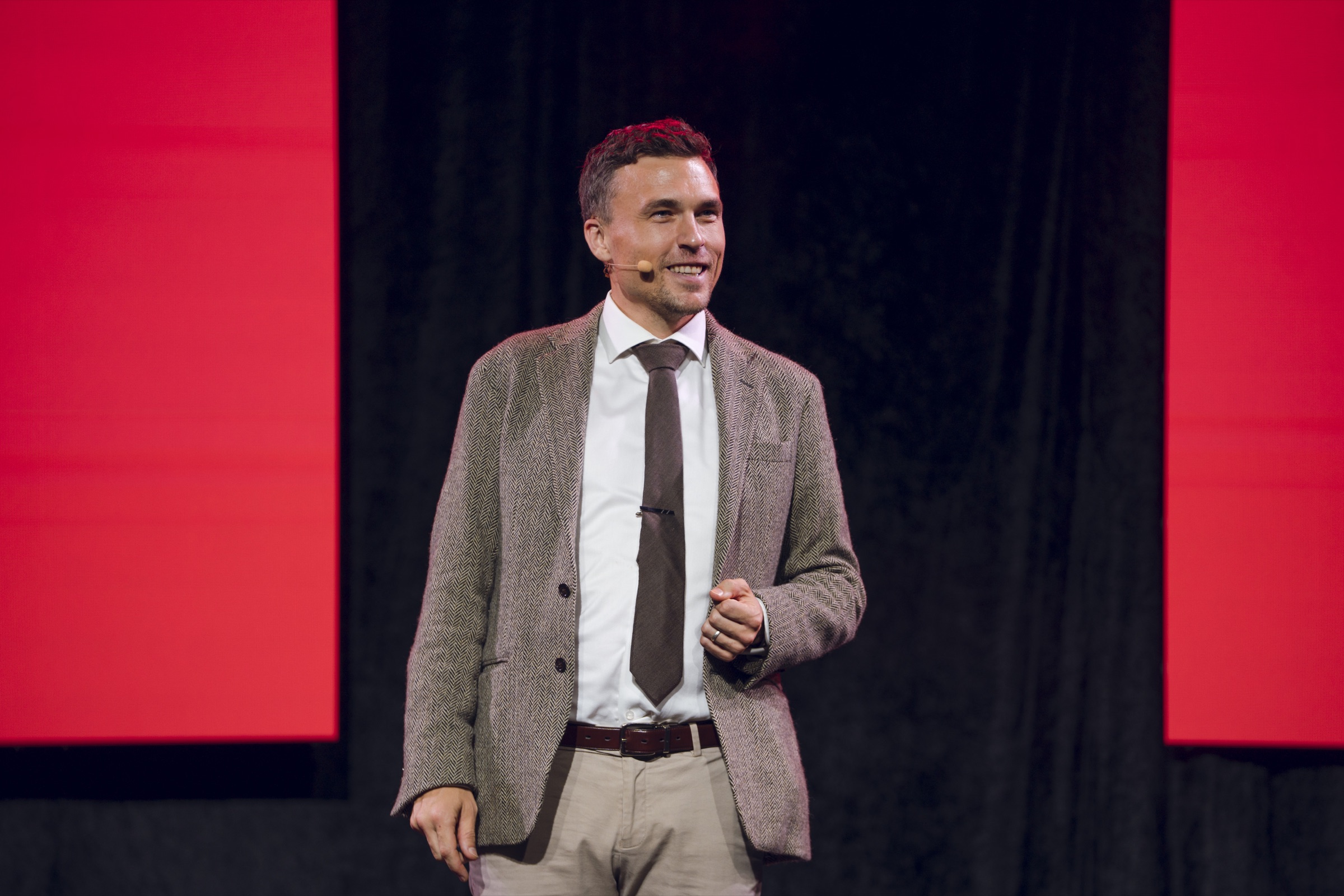 Andy Nunn delivering an interactive keynote on stage in New Zealand