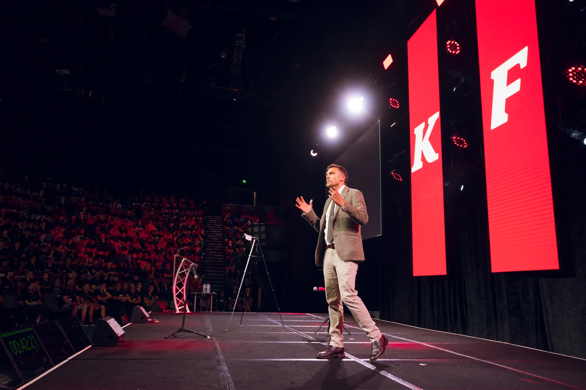Leadership speaker Sydney Andy Nunn presenting to a large conference audience