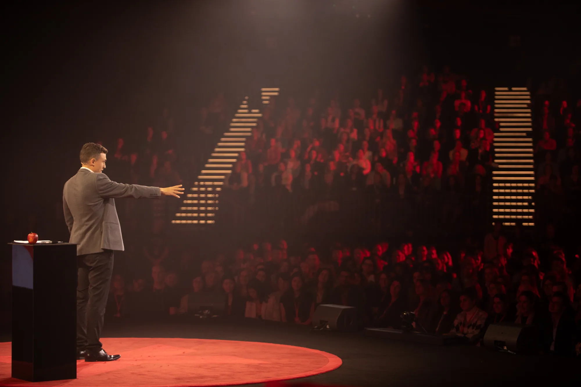 Andy Nunn delivering a keynote to a theatre audience